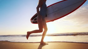 Surfer girl. Young woman in swimsuit runs with surf board on the beach at Campeche surf spot in Brazil - Powered by Shutterstock - Get 15% off with code: PIKWIZARD15