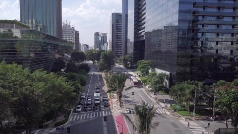 Aerial drone view of empty street in the quarantine of the COVID-19 coronavirus. Faria Lima avenue modern buildings at the lockdown. São Paulo city skyline at the social distancing. Architecture. 4K