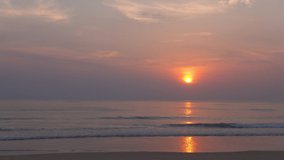 Video Landscape view sunset tropical beach sea. New normal after covid-19. Phuket Thailand beautiful tropical beach with sunset sky. Beautiful Phuket beach is famous tourist destination at Andaman sea