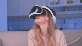 Female Uses Virtual Reality Glasses Looking Learning. Facility Helmet for Simulation Application VR. Close-up Smiling Girl Active Watching Eyes Video in Optical VR Headset. Show Moving Tech Industry 4