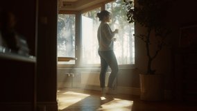 Couple At Home: Woman Watching Out of Window Male Partner Embraces Her From Behind. Happy Couple in Ideal Relationship Spending Sunny Day Together. Beautiful Family Moments - Powered by Shutterstock - Get 15% off with code: PIKWIZARD15