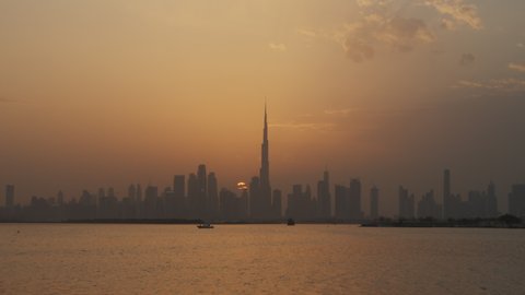 Dubai skyscrapers during sunset. Dubai cityscape with tall skyscrapers and Burj Khalifa in warm golden hour light, Dubai, UAE in 2021