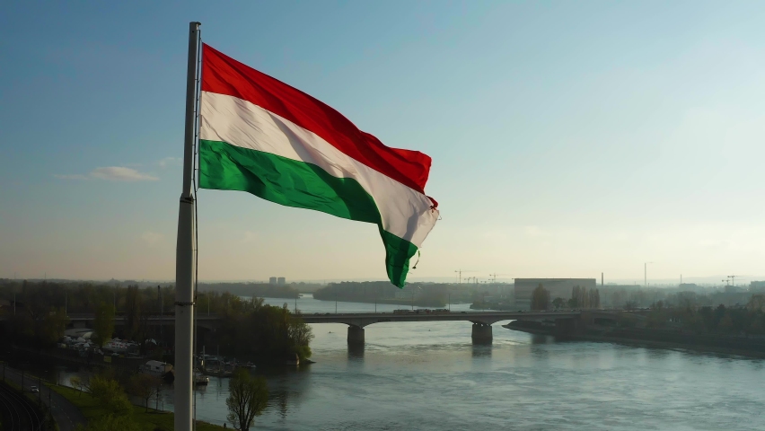 Hungarian flag waving over Budapest, the captial city. 4K orbiting aerial stock footage. Royalty-Free Stock Footage #1070813503