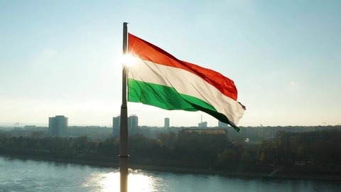Hungarian flag waving over Budapest, the captial city. 4K orbiting aerial stock footage.