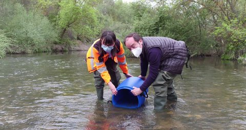 Borja Carabante (Delegate of the Environmental Government Area) in the release of three species of fish, colmilleja, chub and bermejuela, in the Manzanares river in Madrid, Spain, April 16, 2021.