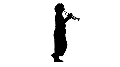 Silhouette Walking clown playing the trumpet.