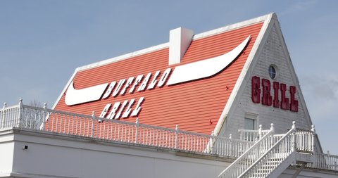 French facade with Logo of Buffalo grill brand store shop in La flèche, France, 14.4.2021 Famous facade of barbecue and meat restaurant in France during covid pandemic
