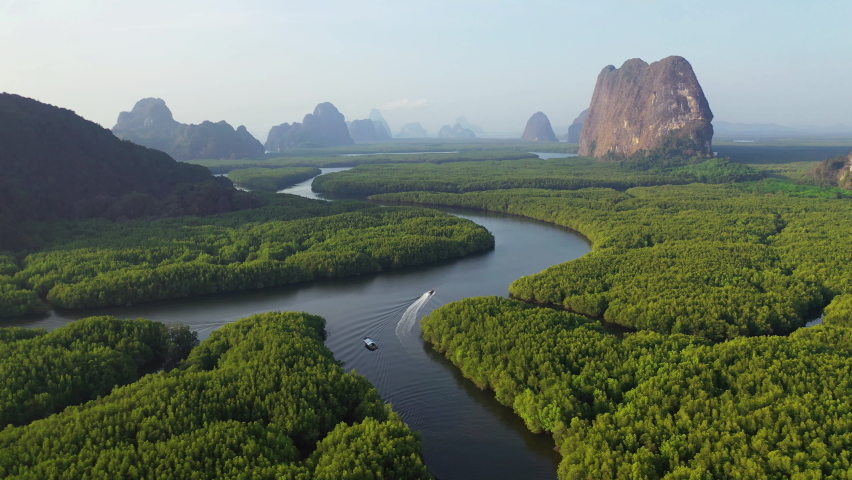 Aerial view of Phang Nga bay with mountains at sunrise in Thailand. | Shutterstock HD Video #1070851948