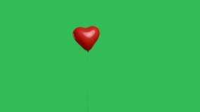 Red heart shaped balloon hanging in air and then falls down against background of green screen chroma key. Balloon as an expression of feelings and love. Valentines day. Slow motion. - Powered by Shutterstock - Get 15% off with code: PIKWIZARD15
