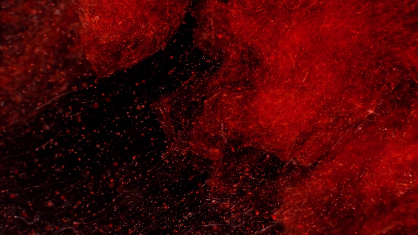 Crimson red Abstract Macro slow motion shot of Particle Fluid isolated on black. paint drops mixing in water. Ink swirling underwater. Colored abstract smoke explosion animation 3D ocean particles 4k | Shutterstock HD Video #1070863363