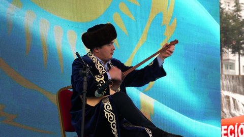 Ankara, Turkey - March 21 2021: Kazakh musician plays dombra  