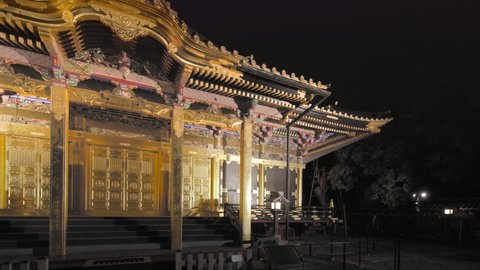 tokyo, japan - november 05 2020: Pan video of the front view of the golden Ueno Tosho-gu shrine dedicated to the Shogun Tokugawa Ieyasu and classed as Important cultural property at night.