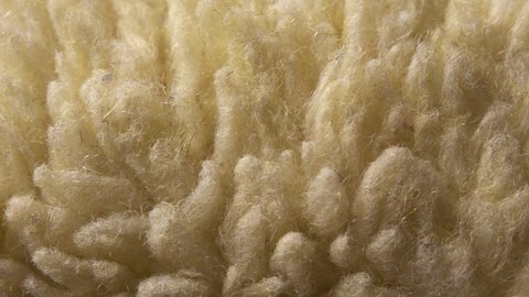 Sheepskin material close-up. Textile background. Macro video slider