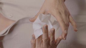 Disinfecting her hands with a wet wipe, the old woman carefully cleans the inside and outside of her hands, between the fingers to her nails. Close-up, concept of the disinfected hand. - Powered by Shutterstock - Get 15% off with code: PIKWIZARD15