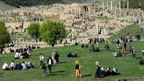 Setif, Algeria - March 12, 2021: Families enjoying spring day near Roman ruins in Djemila. People having fun.
