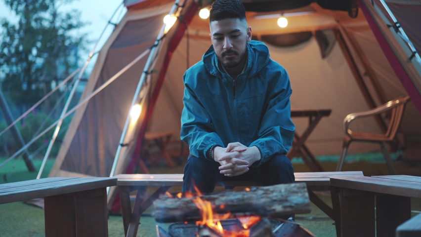 A young woman removing her mask in a green area