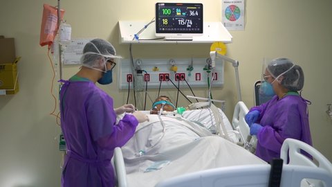 Rio de Janeiro , Brazil - 03 15 2021: Rio de Janeiro, Brazil - March 2021: Doctors work to save a victim of the Covid-19 P1 Brazilian variant in critical condition