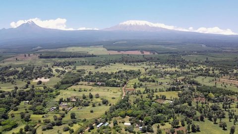Mount kilimanjaro view . Small settlement of houses with Kilimanjaro background. Kilimanjaro Africa kenya Oloitokitok area.