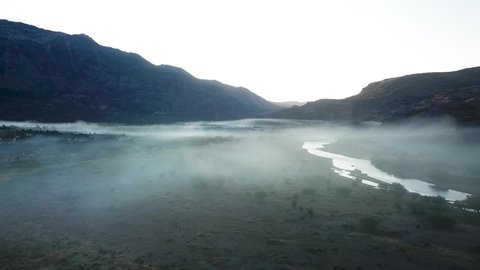 Early morning fog captured with a drone while filming a valley in Argentina