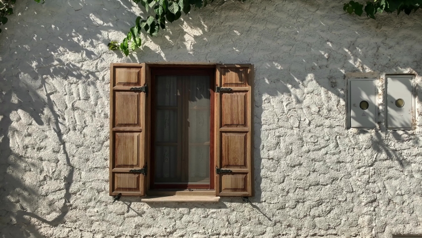 Footage of traditional, old historical house in famous, touristic Aegean town called "Sigacik". It is a village of Seferihisar district of Izmir, Turkey. It is a sunny summer day.