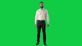 Confident happy business man announcing and talking looking at camera with gesticulation. Full length on green screen chroma key background - Powered by Shutterstock - Get 15% off with code: PIKWIZARD15
