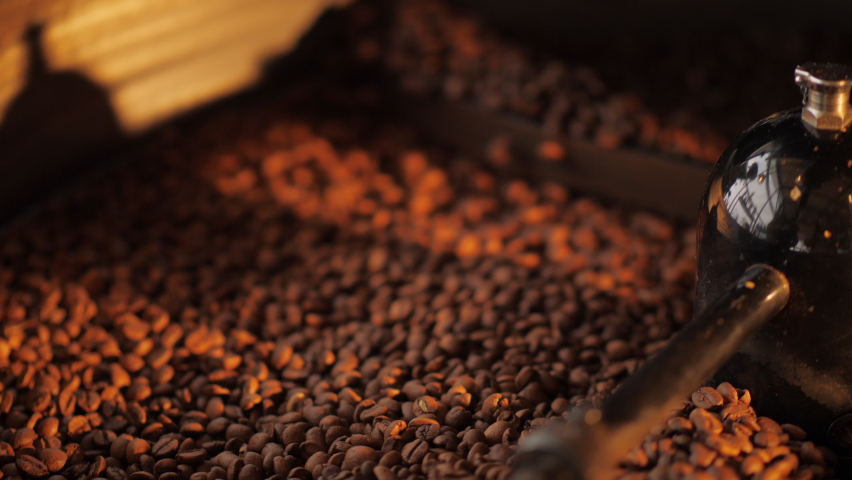 Close up of seeds of coffee. Fragrant coffee beans are roasted, hot aroma coffee and organic freshness, roast coffee industry cooked. Royalty-Free Stock Footage #1070964949