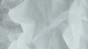 Crumpled sheet of paper. Live wallpaper abstract background. Slow motion. Place for text, title. Can use in vertical position - Powered by Shutterstock - Get 15% off with code: PIKWIZARD15
