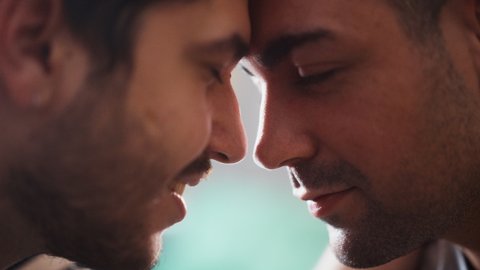 Authentic Close Up Footage of a Stylish Handsome Young Adult Gay Couple Spend Time at Home. Two Happy Men in Love in Casual Clothes Make a Gentle Headbutt. Cute LGBT Relationship Content.