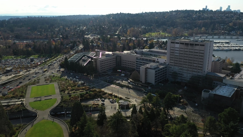 Cinematic aerial dolly drone footage of the University of Washington Medical Center and University of Washington School of Medicine with the University of Washington buildings in the front in Seattle