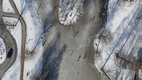 Top down aerial of people skating on frozen pond in the Netherlands - Powered by Shutterstock - Get 15% off with code: PIKWIZARD15