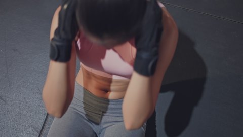 Close up of Asian Athlete beautiful female doing sit-up exercise on floor for abdomen workout. Young active sportswoman in sportswear building muscle and strength for Healthcare in fitness or sport gym.