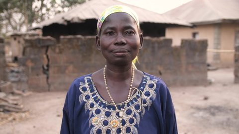 24th March 2021, Lagos Nigeria: Africa  village woman standing in front of her house 