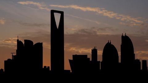 Riyadh City Towers in Saudi Arabia, Time Lapse at Sunrise with Colorful Clouds