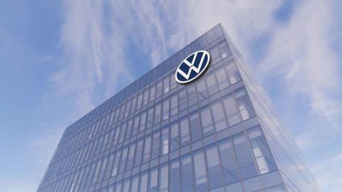 Wolfsburg, Germany. January 20, 2022. Editorial Use Only, 3D CGI. Volkswagen Automaker Corporation Motors Signage Logo on Top of Glass Building. Workplace VW Car Company Office Headquarters.