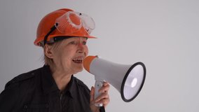 Engineer builder at the construction of a building. Portrait of mature woman with shout - Powered by Shutterstock - Get 15% off with code: PIKWIZARD15