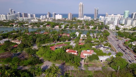 Aerial video Miami luxury homes and Indian creek with view of ocean 5.4k aerial