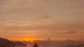 red sunrise over sea video 4K. Nature video High-quality footage shot with Blackmagic pocket cinema camera 6K. Scene of Colorful romantic sky sunrise with Changing the color of the sky background.
