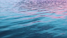 The water surface with small waves at the sunset relaxation video