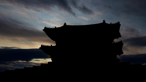 Gyeongbokgung Palace: Time Lapse at Sunrise with Fast Clouds and Dark Silhouette of Gwanghwamun Gate, Seoul, South Korea