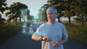 Old male sportsman running using latest innovative technology smart watch with augmented reality hologram, checking life system status. Future sport and healthcare concep, immersive digital technology - Powered by Shutterstock - Get 15% off with code: PIKWIZARD15
