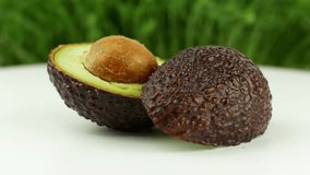 Rotation Avocado slow-motion close-up 4K video. A product of healthy and wholesome food for every day. The southern fruit is an alligator pear. Healthy Vegan Food Concept