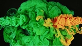 Ink in water blending together. Green and orange - Powered by Shutterstock - Get 15% off with code: PIKWIZARD15