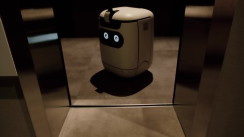 Modern robot gets in the elevator. Robot emotion.