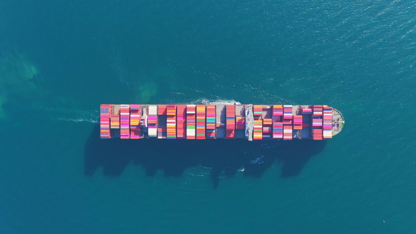 Aerial top view Container carrier ship and business logistic commercial intermodal freight transport in import export, Cargo ship of international travel sea freight around the world. 4K | Shutterstock HD Video #1071057301