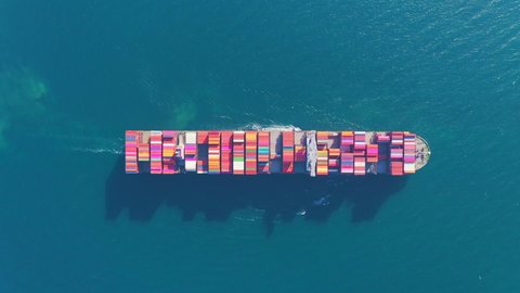 Aerial top view Container carrier ship and business logistic commercial intermodal freight transport in import export, Cargo ship of international travel sea freight around the world. 4K