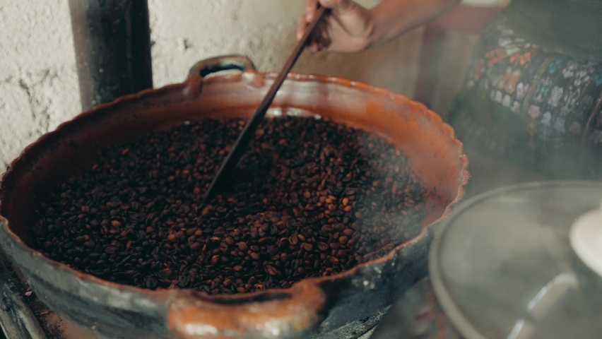 Woman's Hand Roasting Coffee In A Big Pot In Guatemala, Central America - close up | Shutterstock HD Video #1071063088