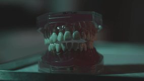 Close up video of teeth as the light moves over the top of the subject