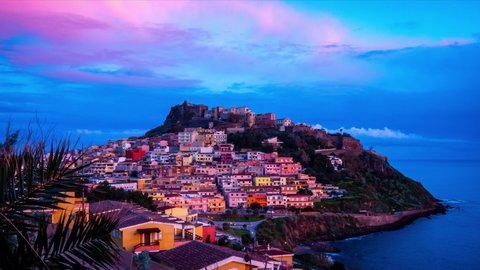 Colourful houses and a castle of Castelsardo town in Sardinia at sunrise