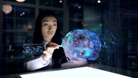 Asian woman Scientist work on 3D Simulated holographic Neural Brain Interface. Engineer using Augmented Holographic Technology. Artificial Intelligence Concept - Powered by Shutterstock - Get 15% off with code: PIKWIZARD15