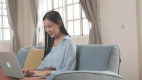 Woman Sitting Sofa And Use Laptop Computer In Living Room, Video In 4K
